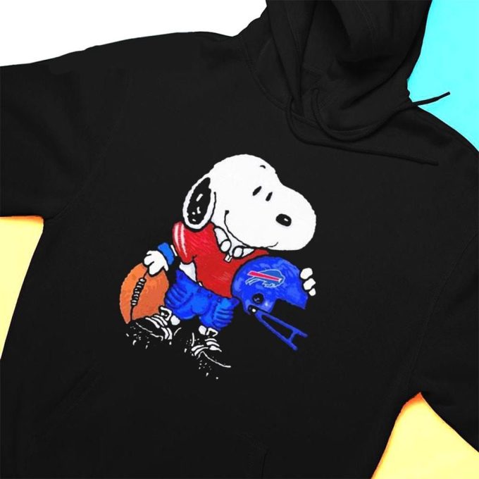 Snoopy Buffalo Bills Football T-shirt: Show Your Team Spirit with Peanuts Official Merch! Snoopy Buffalo Bills Football T-shirt: Show Your Team Spirit with Peanuts Official Merch!